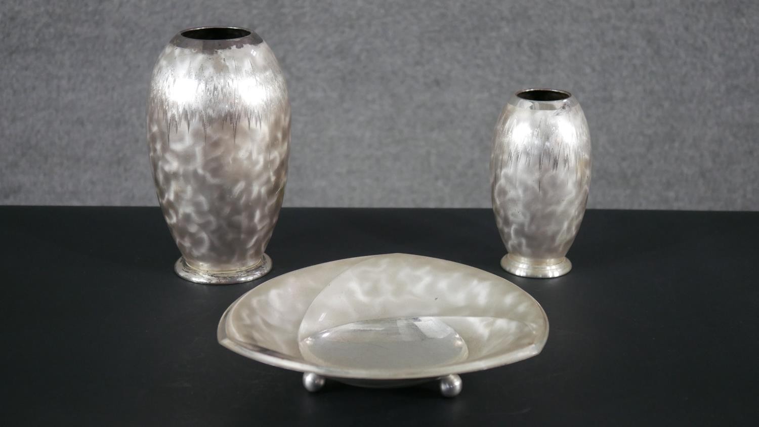 A collection of Art Deco Ikora silver plated pieces by WMF, including two vases with zigzag design