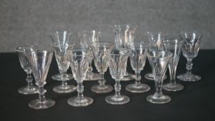 A collection of fourteen 19th and early 20th century trumpet shaped sherry and cordial glasses, some