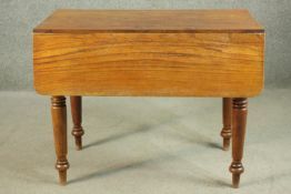 A Victorian Pembroke table, with drop leaves over an end drawer, on turned legs. H.70 W.44 D.
