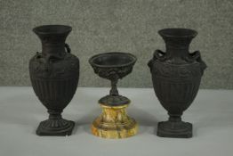 Two black glaze clay classical urn design vases, adorned with two goat head handles along with a