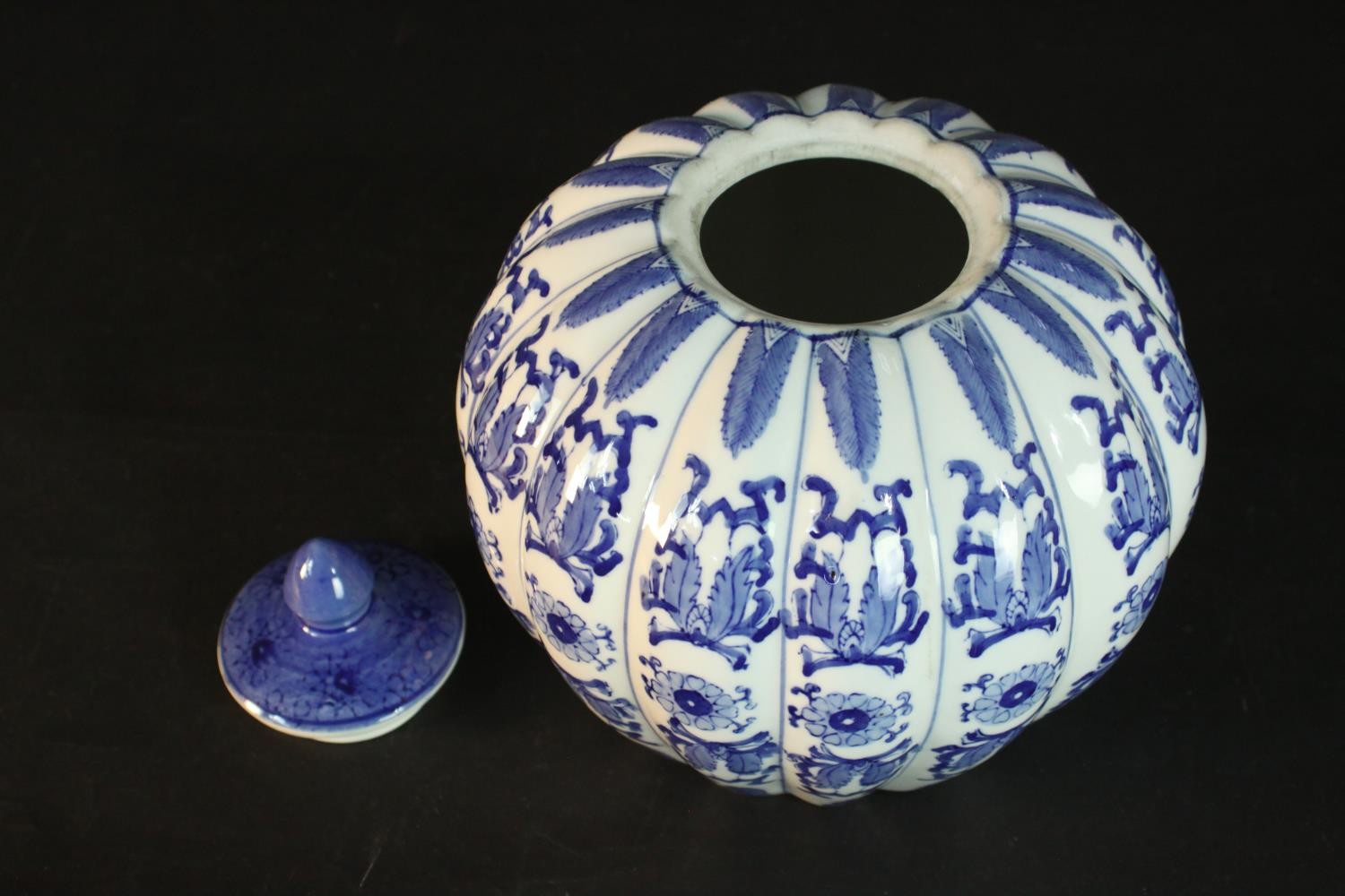 A blue and white Chinese ceramic gourd form lidded jar with stylised floral design and character - Image 3 of 5