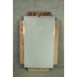 An Art Deco mirror, of rectangular form, with a peach glass frame. H.78 W.48cm.