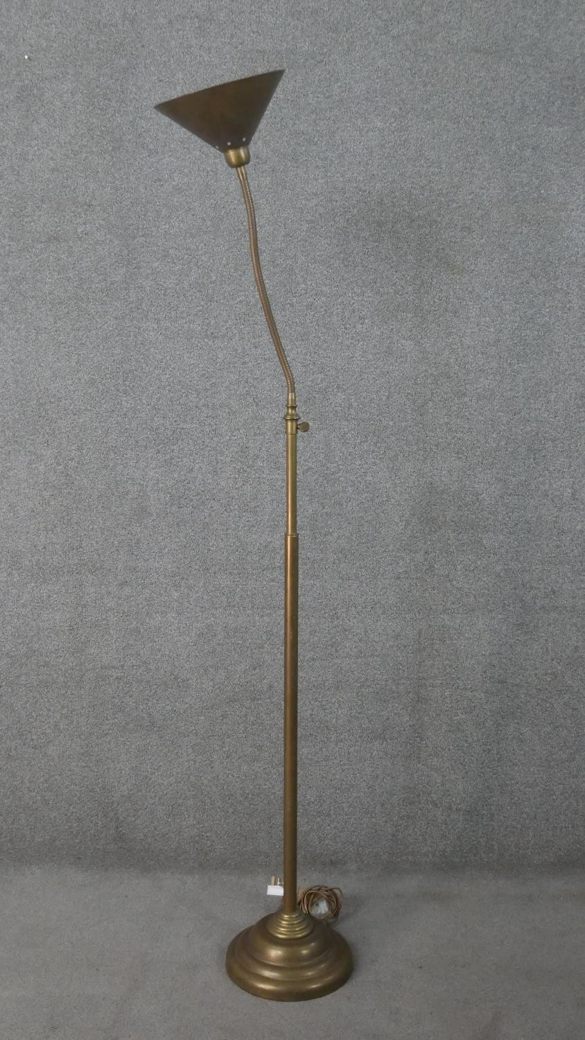 A Laura Ashley brass adjustable floor lamp with conical shade. H.174 Diam.37cm