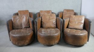 A set of six Art Deco style tub chairs, in brown leather with black leather detail to the arms,