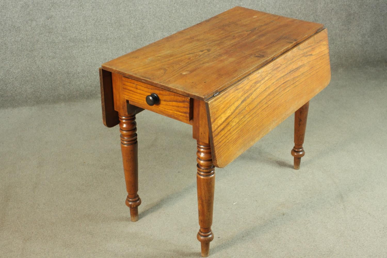 A Victorian Pembroke table, with drop leaves over an end drawer, on turned legs. H.70 W.44 D. - Image 4 of 7