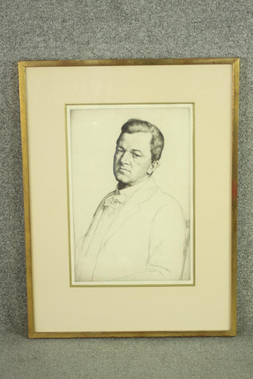 A framed and glazed etching of a portrait of a gentleman in suit and bowtie. Indistinctly signed. - Image 2 of 6