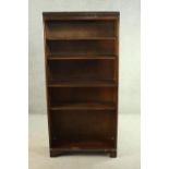 A mahogany bookcase, with a dentil cornice over four shelves, on shaped bracket feet. H.170 W.80 D.