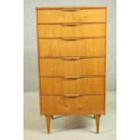 A circa 1960's teak Grange tallboy chest of six long drawers, on shaped tapering legs, bearing label