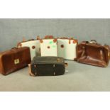 A collection of six vintage suitcases, including a set of cream and tan leather trim Bojola,