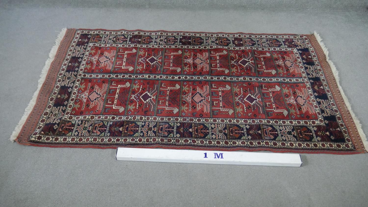 A Persian Kurdish rust ground hand made rug. L.200 W.115cm. - Image 2 of 5
