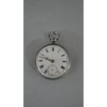 A Victorian silver gentleman's pocket watch with white enamel dial and black Roman numerals. (