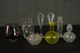 A collection of cut crystal and glass ware, including a yellow art glass vase, a pair of Art Deco