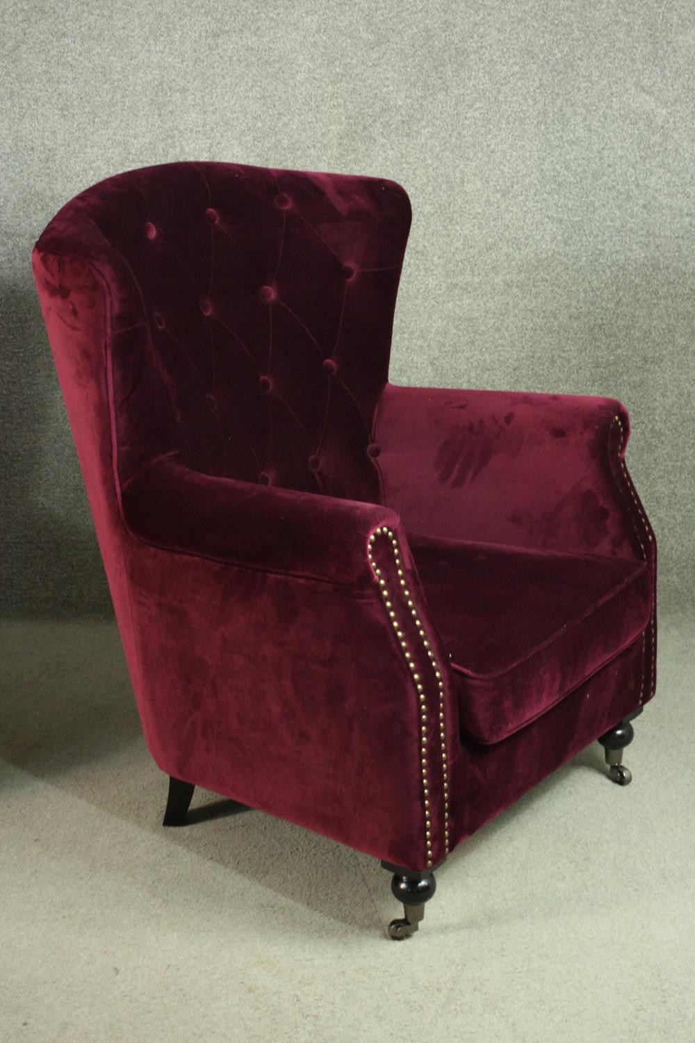 A pair of Victorian style wingback armchairs, upholstered in purple velour, with a buttoned back, - Image 7 of 9