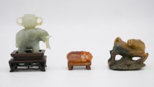 Three Chinese carved stone pieces, including a Jade elephant on carved stand (handle of basket