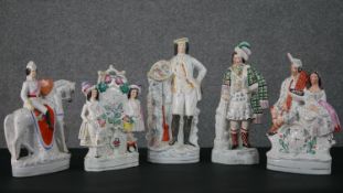 A collection of four 19th century flat back Staffordshire pottery figures, including Robert the