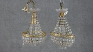 A pair of Empire style brass and crystal drop tent chandeliers. H.28 Diam.20cm