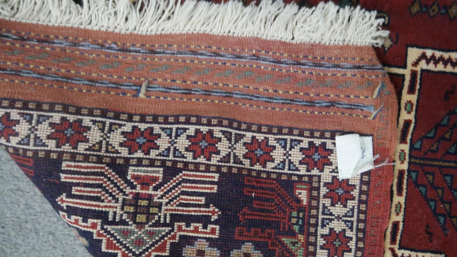 A Persian Kurdish rust ground hand made rug. L.200 W.115cm. - Image 5 of 5
