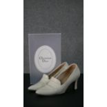 A pair of boxed Christian Dior cream Nappa leather heeled loafers, size 4 1/2.