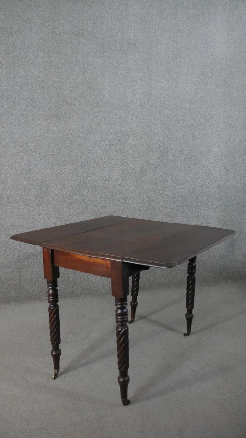 A Victorian mahogany drop leaf dining table, with turned and wrythen legs. H.70 W.93cm (Extended) - Image 2 of 7