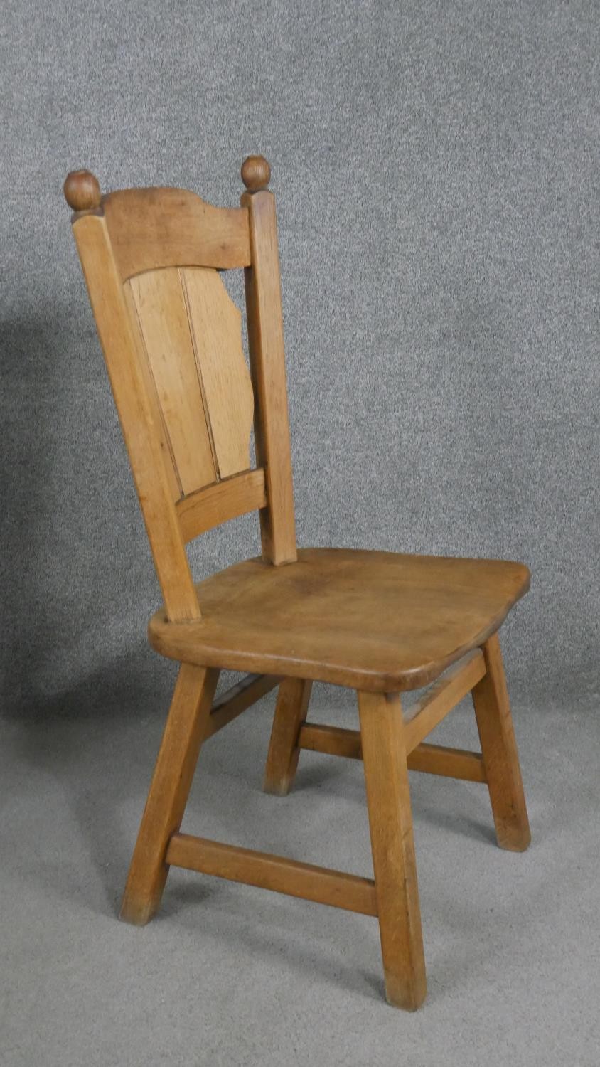 A set of six oak dining chairs, the shaped plank back, over a solid seat, on splayed square - Image 6 of 6