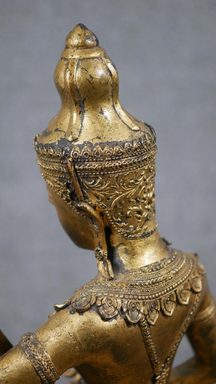 A 19th century gilded bronze Thai figure of Saraswati playing a vina. Animals and trees around the - Image 9 of 10