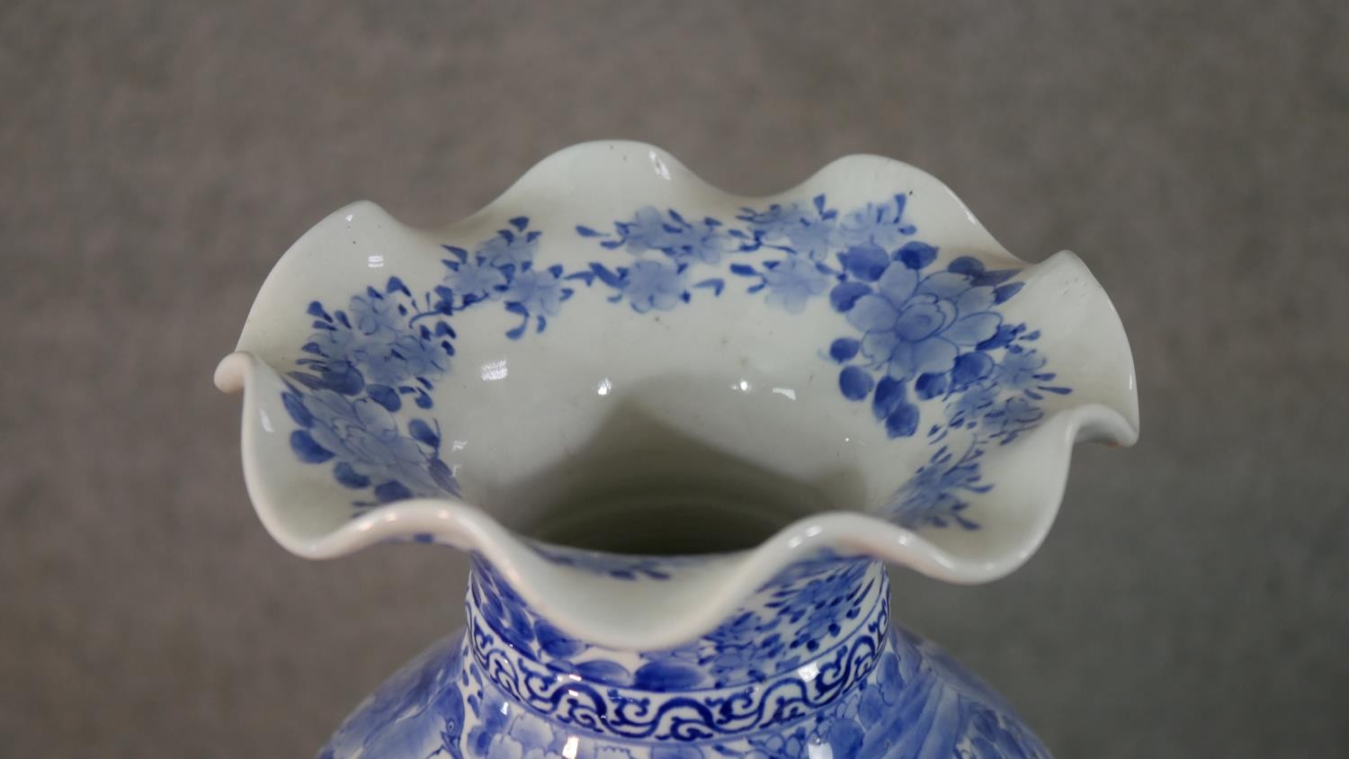 A large Japanese early 20th century blue and white hand painted porcelain vase with fluted edge. - Image 3 of 12