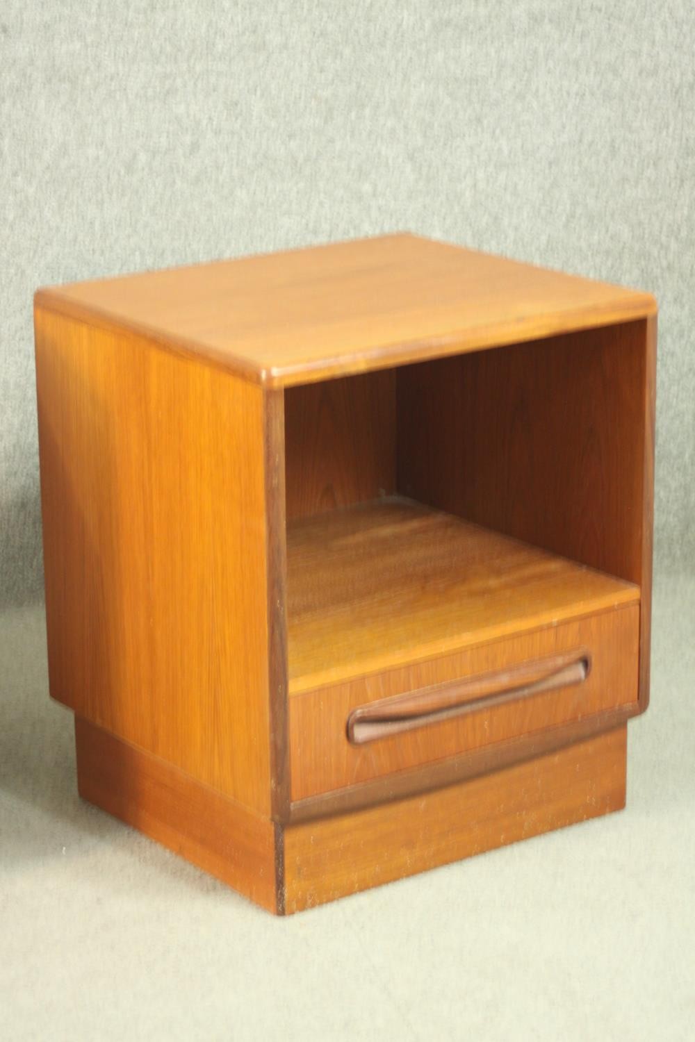 A pair of G-Plan teak bedside cabinets, with a recess over a single drawer, on a plinth base. H.53 - Image 6 of 13