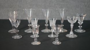A collection of eleven 19th and early 20th century trumpet shaped sherry, cordial and toast master