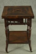 An Edwardian walnut envelope card table, the square top opening to reveal a green baize interior, on