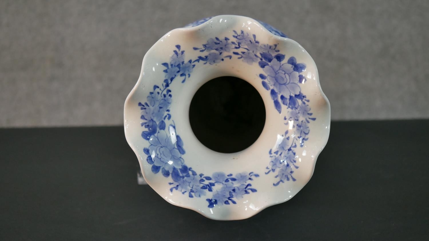 A large Japanese early 20th century blue and white hand painted porcelain vase with fluted edge. - Image 9 of 12