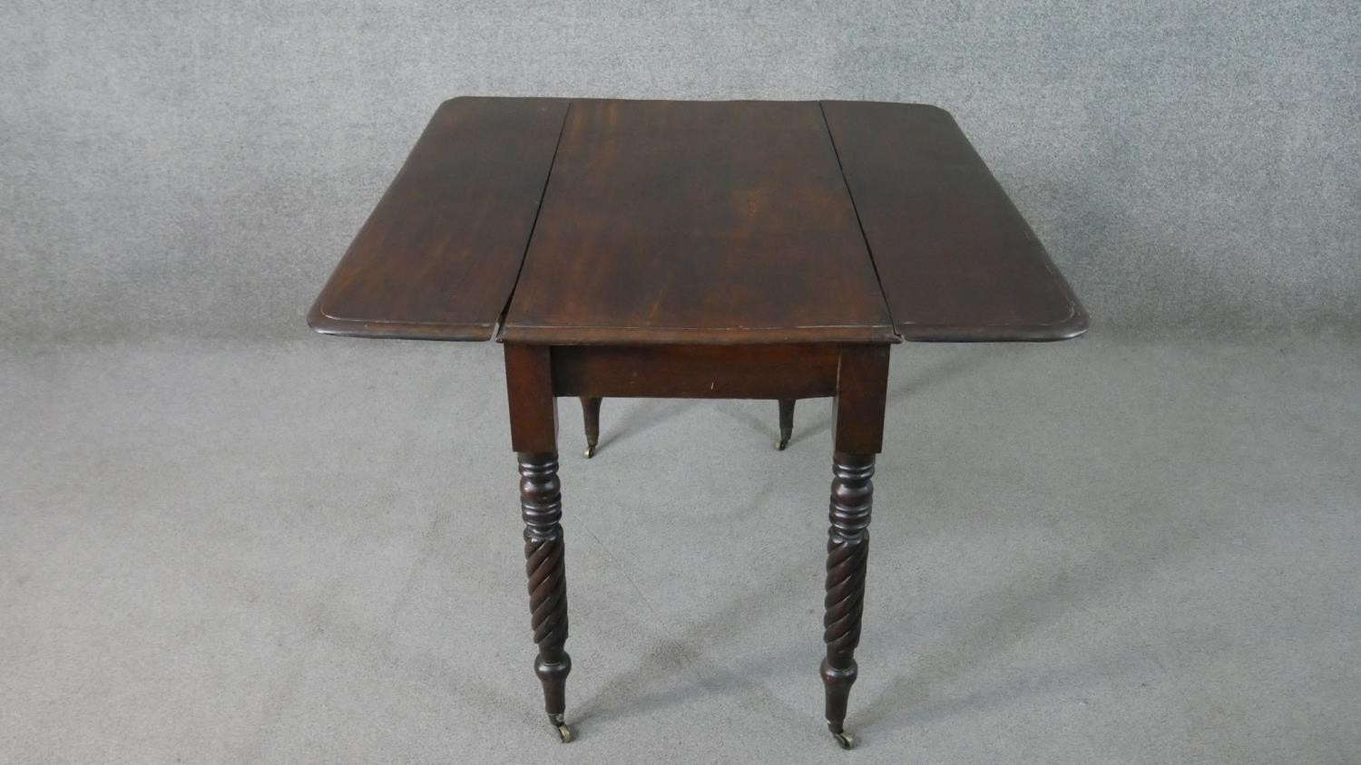 A Victorian mahogany drop leaf dining table, with turned and wrythen legs. H.70 W.93cm (Extended) - Image 6 of 7