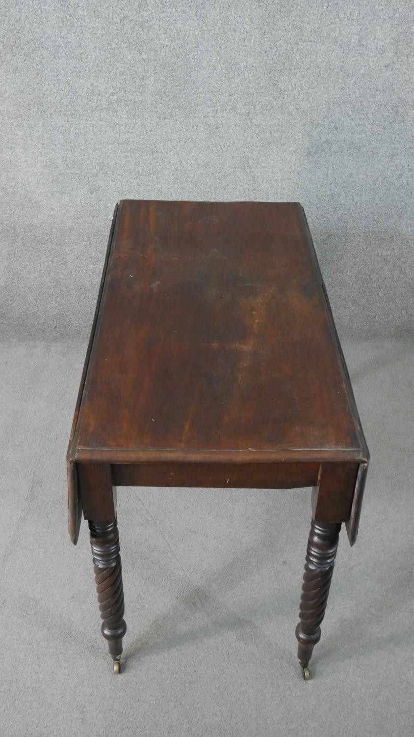 A Victorian mahogany drop leaf dining table, with turned and wrythen legs. H.70 W.93cm (Extended) - Image 3 of 7