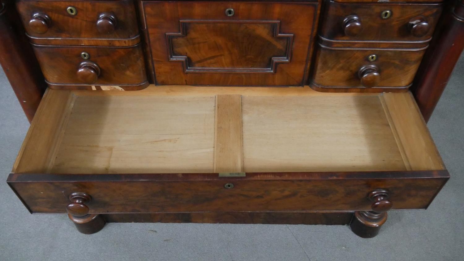 A William IV flame mahogany Scottish chest, with a cushion drawer over a hat drawer, flanked by - Image 6 of 7