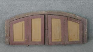 A rounded arched set of windows, in a painted frame, with shutters. H.53 W.129 D.9cm (closed)