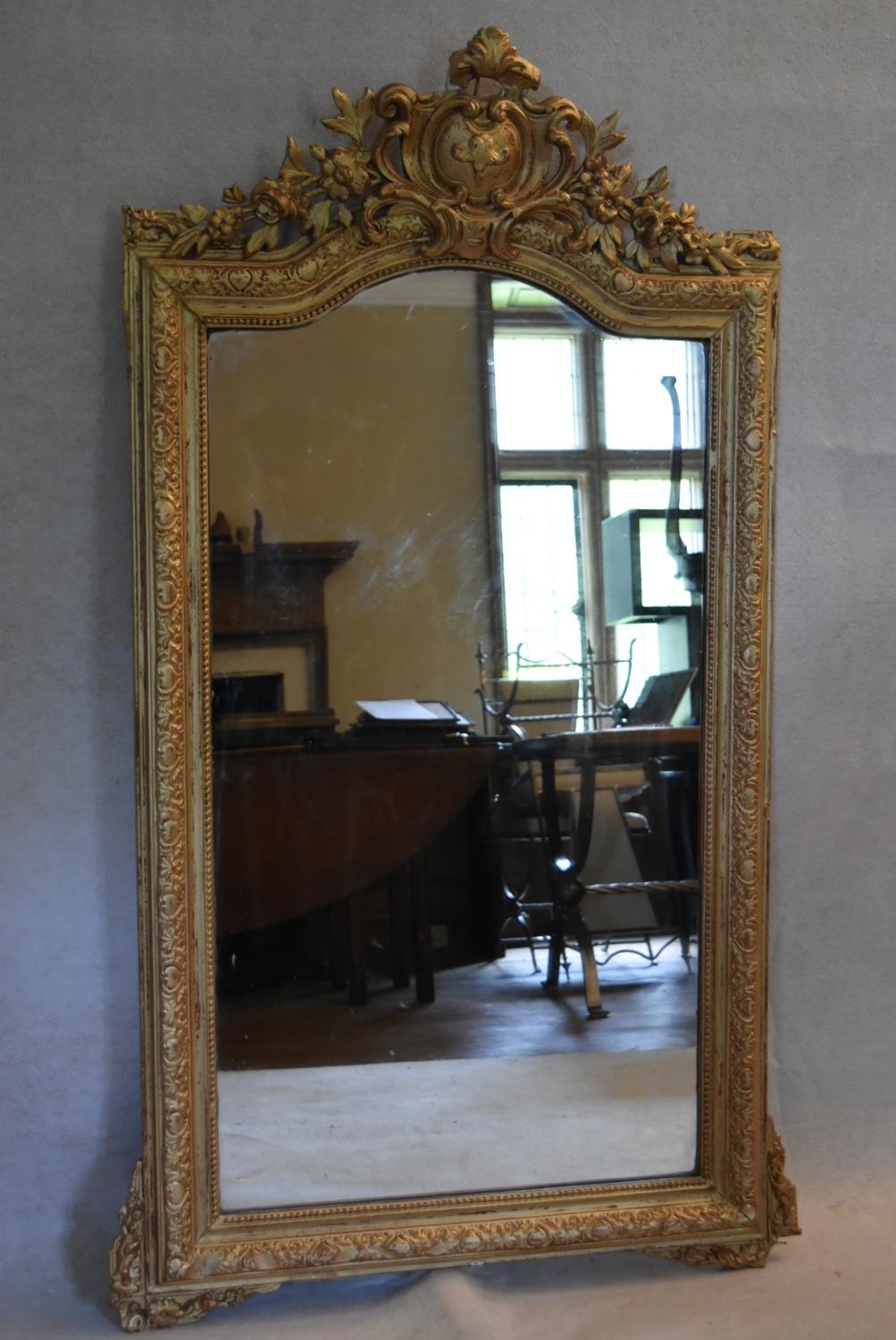 A 19th century overmantel or pier mirror in a gold painted foliate gesso frame. H.153 W.92cm - Image 3 of 6