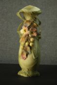 A Royal Dux painted bisque porcelain Art Nouveau twin handled vase of naturalistic sinuous form,