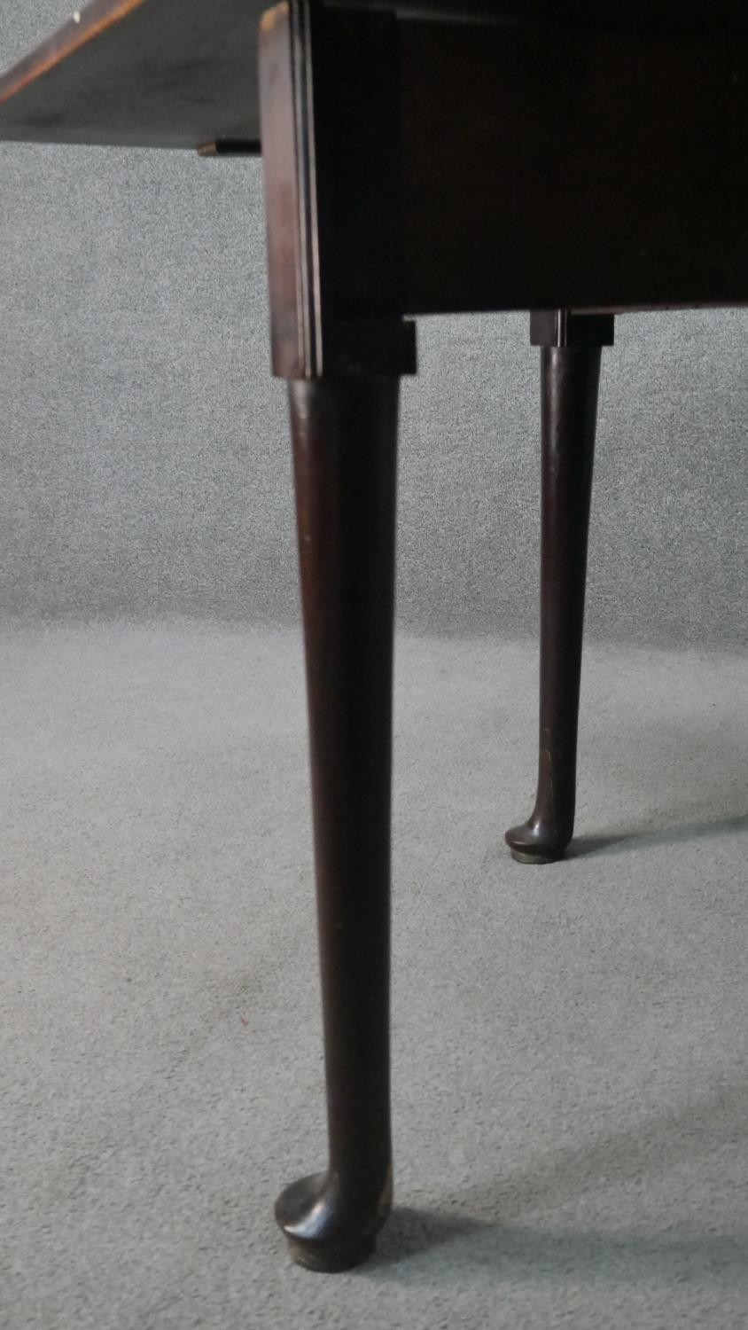 A mid 18th century mahogany drop leaf dining table, with a rectangular top, the legs with pad - Image 7 of 7