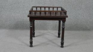 A late Victorian mahogany occasional table, of square form with a full gallery and turned