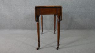 A 19th century mahogany drop leaf dining table, on turned legs. H.72 W.83 D.91cm (Extended)