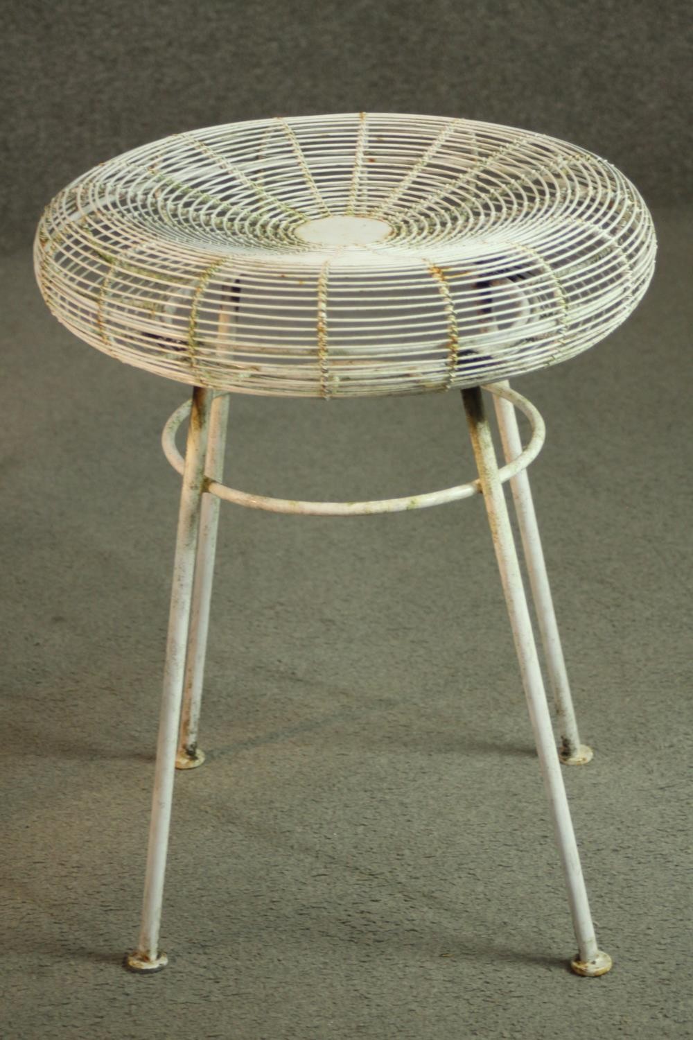 A white painted iron garden set, comprising a circular table and four stools. H.72 Dia.70cm (table) - Image 6 of 7