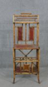 An Aesthetic movement bamboo hall stand, with Japanese red lacquered panels. H.133 W.50 D.50cm