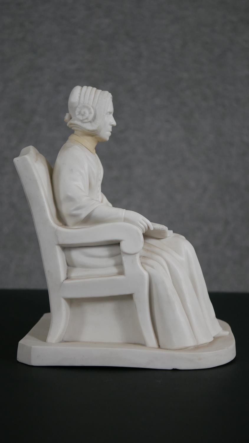 A Minton Parian ware model of an elderly lady seated in an armchair, a book open on her lap. - Image 2 of 8