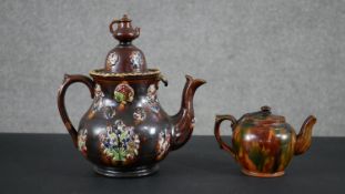 A Victorian barge ware teapot, inscribed "Forget me Not " to the centre along with treacle glaze