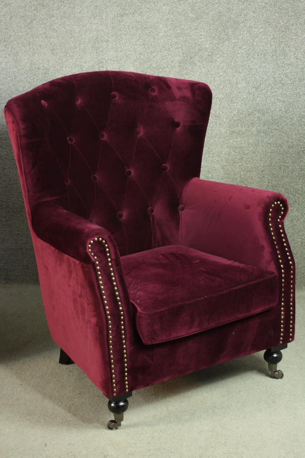 A pair of Victorian style wingback armchairs, upholstered in purple velour, with a buttoned back, - Image 8 of 9