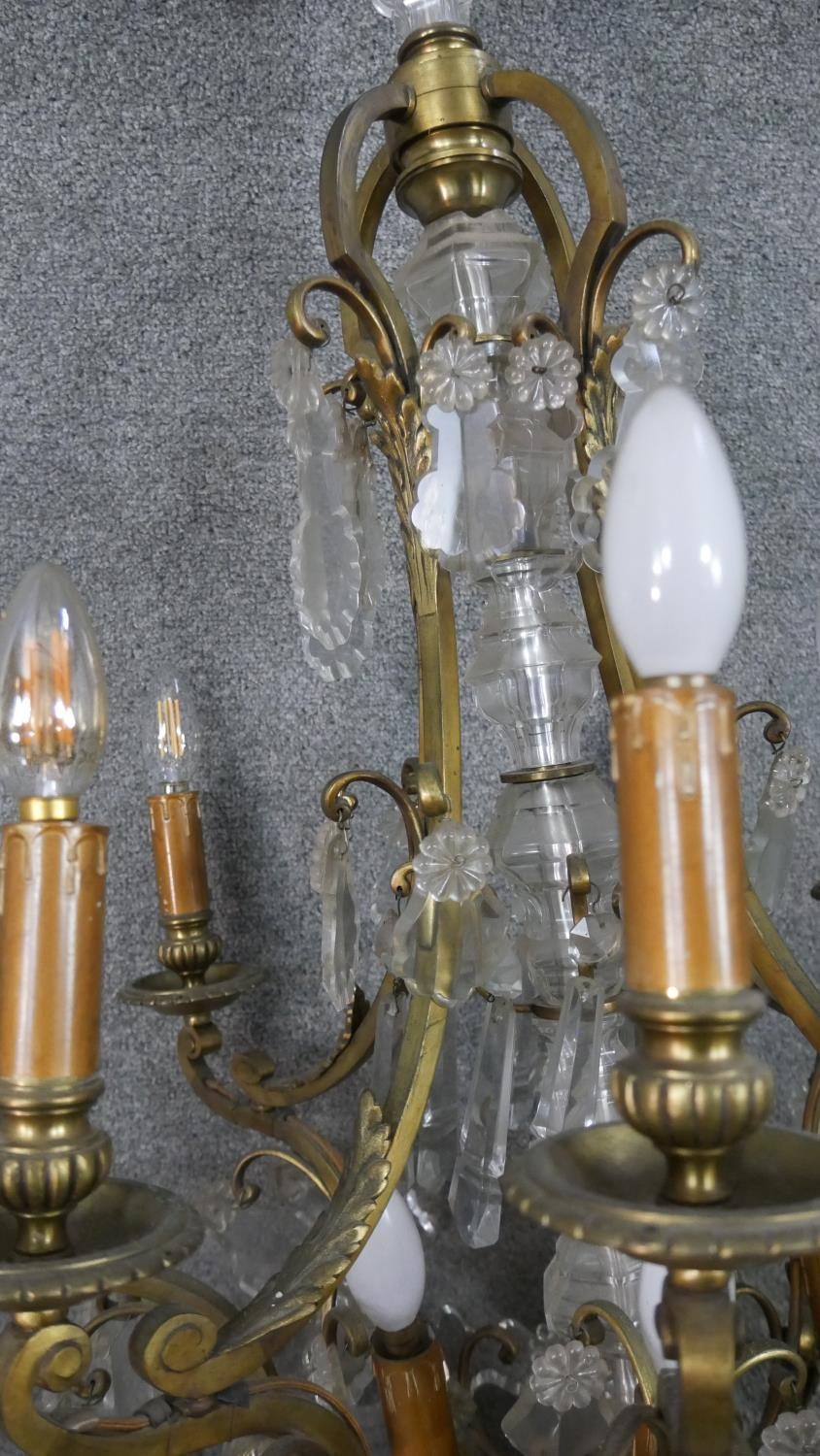 A scrolling gilt brass and crystal eight branch chandelier with hanging crystal drops and foliate - Image 9 of 11