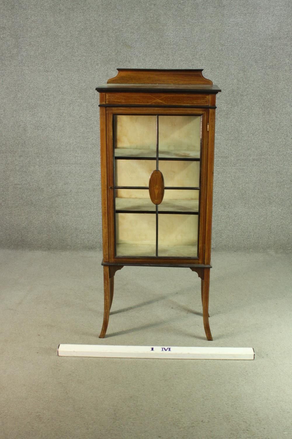 An Edwardian walnut display cabinet, with a gallery top, over a glazed door and sides, enclosing - Image 2 of 7