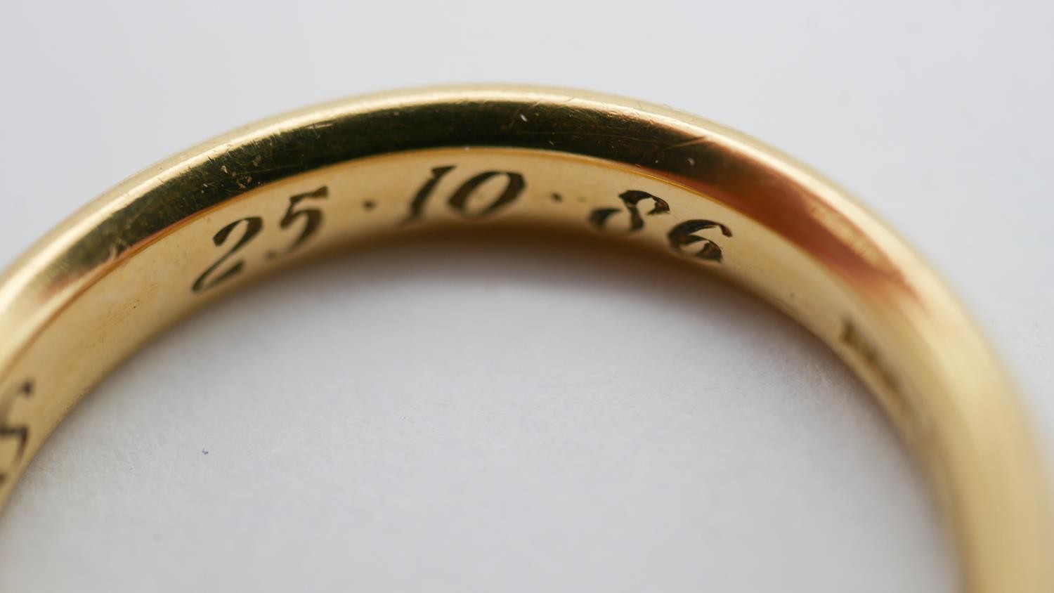 A size Q 18 carat yellow gold court shaped wedding band, engraved to the interior 'REF. HBS, 25.10. - Image 3 of 6