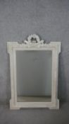 An early 20th century carved mirror with flaming torch and foliate detailing. H. W.cm