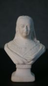 A composite marble bust of Queen Victoria, with engraved name. H.14.5 W.10 D.7cm