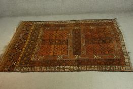 A gold ground hand made Afghan rug. L.215 W.150cm